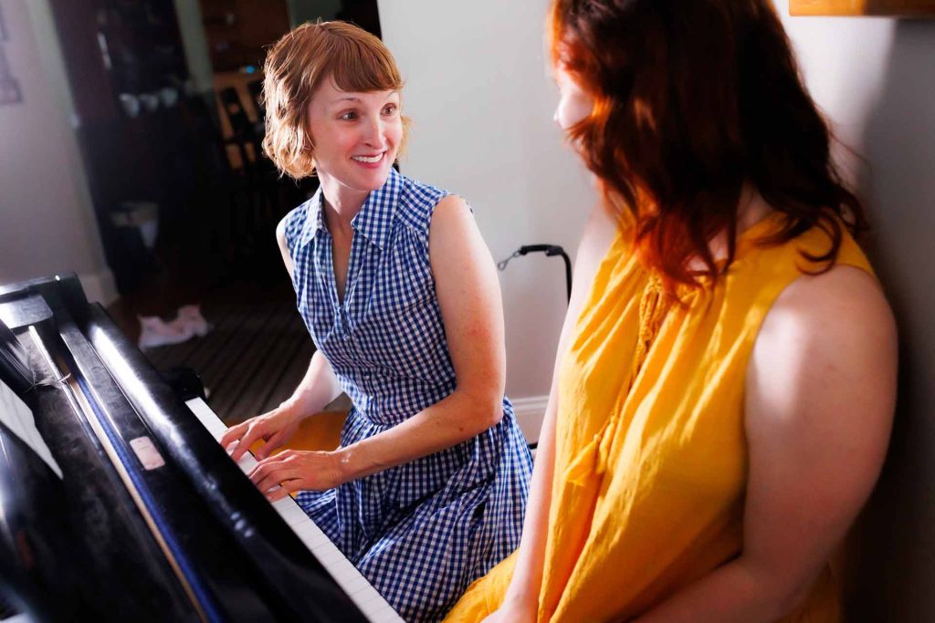 Woman takes a piano lesson in Highland Park, IL