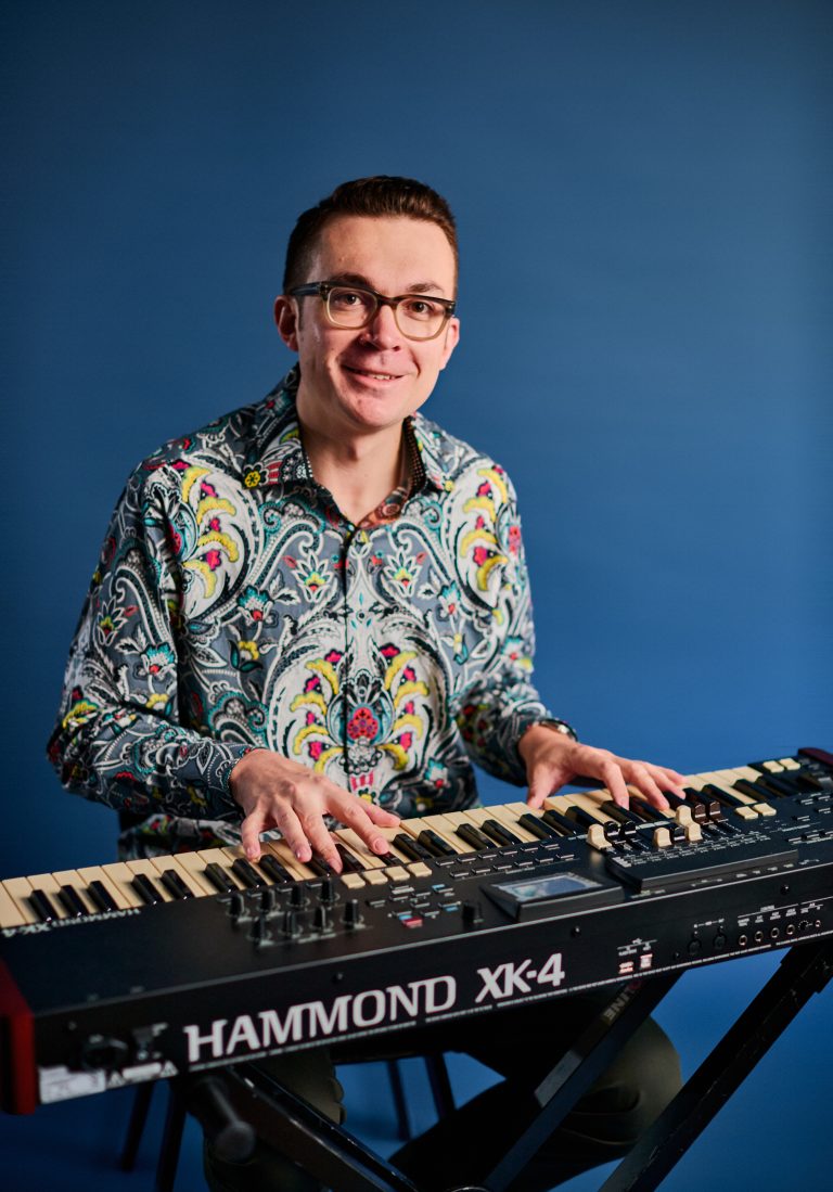 Young man plays a keyboard